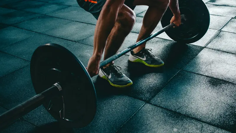 Person lifting a barbell during a workout