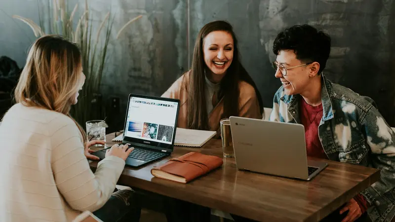 People talking warmly together around a table